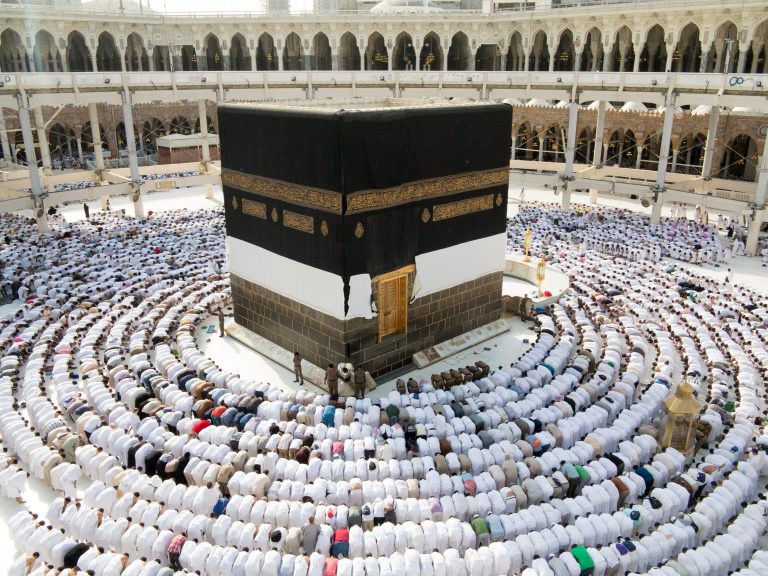 Kaaba the Holy mosque in Mecca with Muslim people pilgrims of Hajj praying in crowd (newest and very rare images of Holiest mosque after latest widening 2013 2014)
